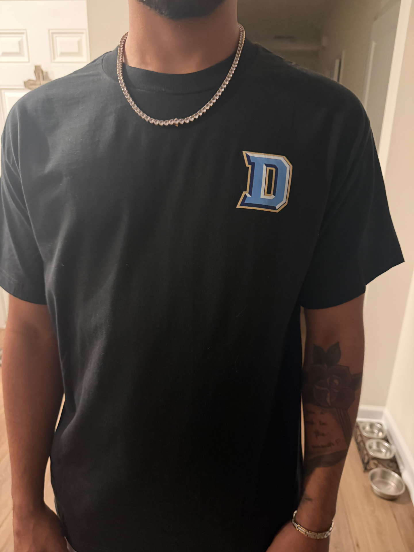 Custom black t-shirt with blue varsity D pocket print